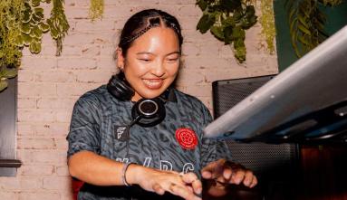 DJ and designer Grace Ktown performing on a turntable.